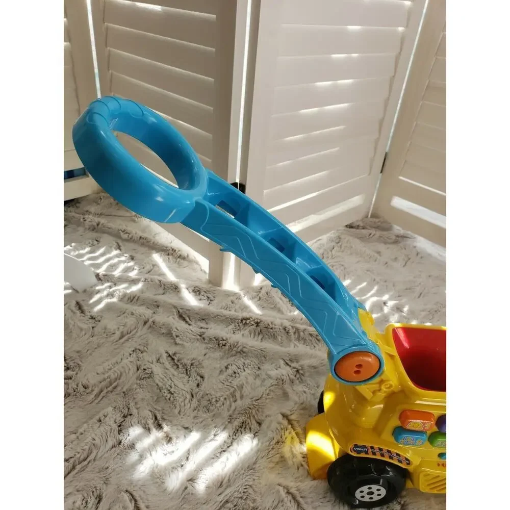 V TECH PUSH AND POP MUSICAL BULLDOZER